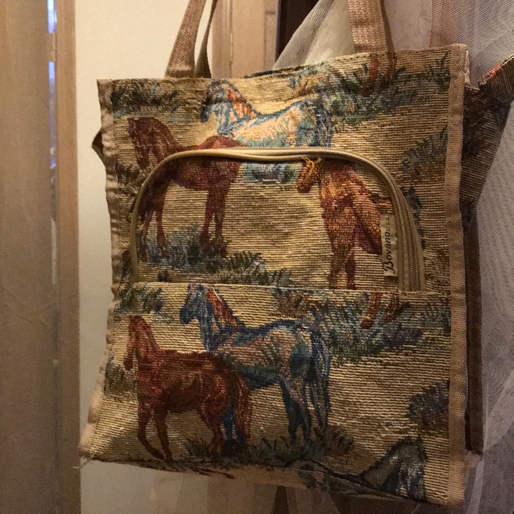 Burlap sewn purse with horses on it.